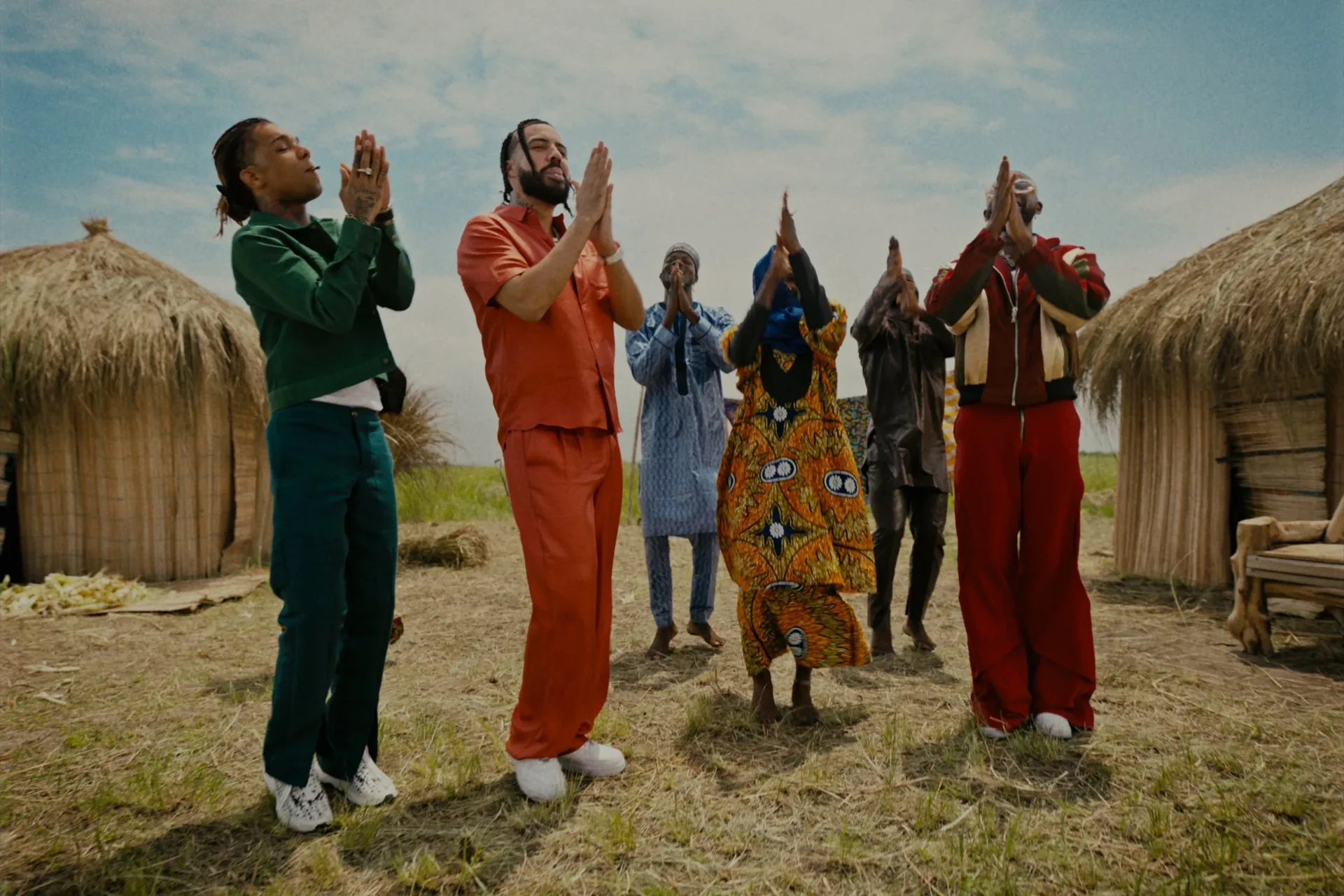 French Montana Swae Lee Wish U Well group prayer village scene